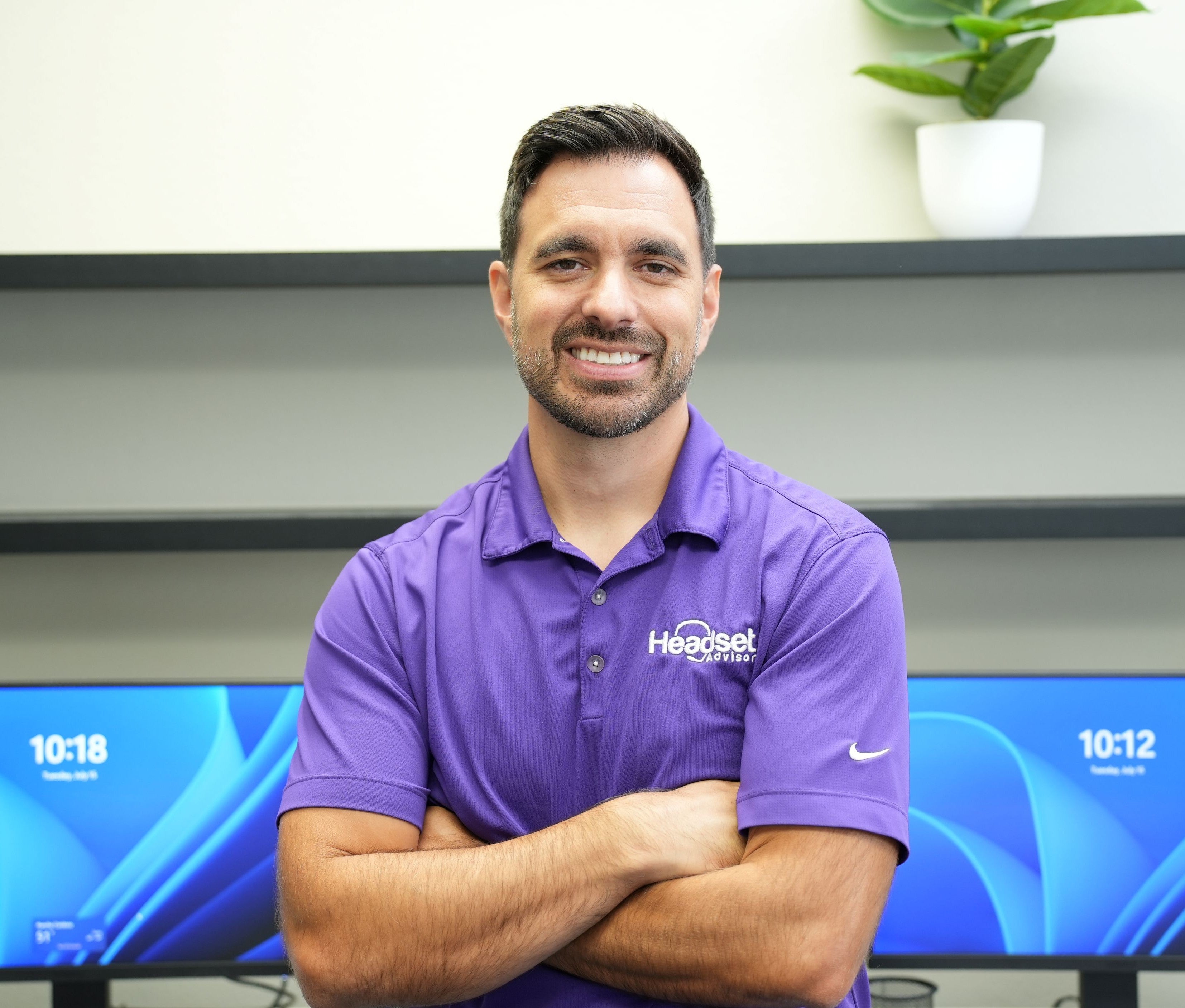 david merritt wearing purple headset advisor shirt while smiling